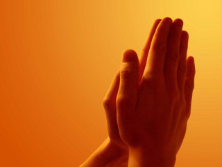 Praying hands orange background yellow - a persons hand free wallpaper
