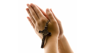Person holding cross arm chain - their arm free wallpaper