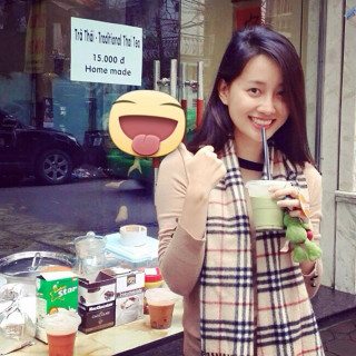 Woman holding drink face mask - a store window free wallpaper