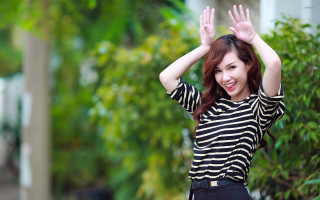 Woman striped shirt waving hands - cheerful free wallpaper