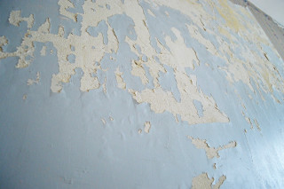 Peeling paint wall clock side - side of its free wallpaper