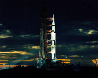 Large rocket building cloudy night - alan bean free wallpaper