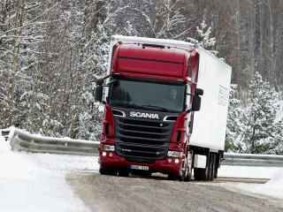 Red semi truck snowy forest - snow and ice free wallpaper
