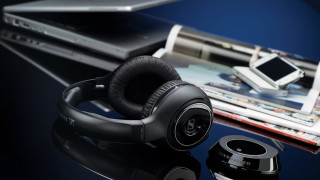 Headphones table laptop magazine cellphone - a pair of headphones free wallpaper