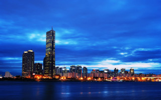 City skyline tall building night 15 - a body of water in front free wallpaper for desktop