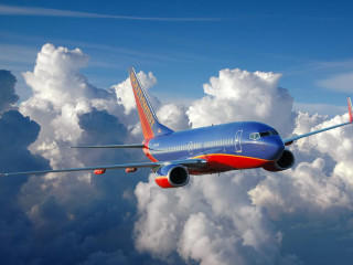 Blue red airplane flying clouds - cloud below free wallpaper for desktop
