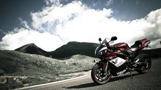 Red motorcycle parked road mountains - a red motorcycle free wallpaper