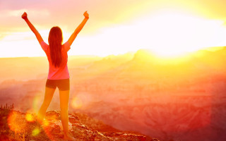 Woman mountain arms raised victory - top of a mountain free wallpaper