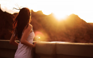 Woman bridge hair blowing sun - behind her free wallpaper