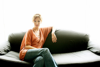 Woman couch window black cushion - a black couch free wallpaper