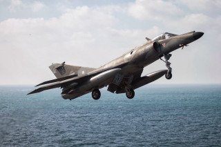 Fighter jet ocean cloudy landing - a landing free wallpaper