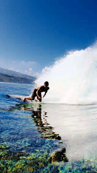 Surfing man ocean sky beach - a wave free wallpaper for mobile