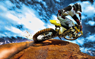 Man riding dirt bike hill 3 - dee whitcomb free wallpaper