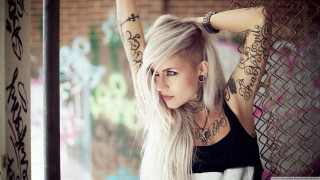 Tattooed woman white hair fence - her arm behind her head free wallpaper