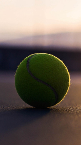 Tennis ball ground blurry background - a tennis ball free wallpaper for mobile