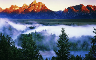 Mountain range river trees foggy - a foggy valley below free wallpaper