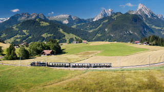 Train countryside mountains trees sunny - a train traveling free wallpaper for desktop