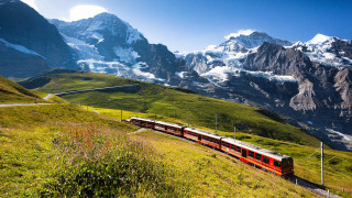 Train lush valley snowy mountains - a train traveling free wallpaper for desktop