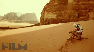 Man helmet backpack desert mountain - a desert area free wallpaper