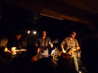 People playing instruments dark room - deep shadow free wallpaper