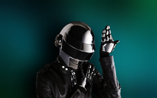 Man leather suit helmet holding - both hand free wallpaper