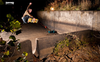 Man skateboarding cement ramp night - a man riding free wallpaper