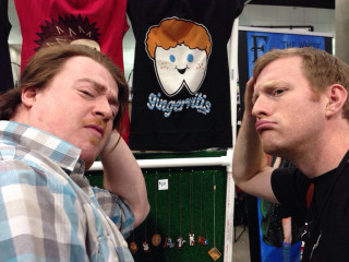 Two men sitting shirt rack - fructose free wallpaper