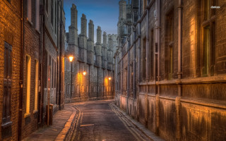 Narrow alley street light buildings - a row of buildings free wallpaper
