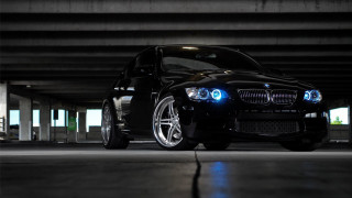 Black car blue lights parking - a parking garage free wallpaper
