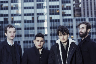 Men group standing tall building - skyscraper free wallpaper