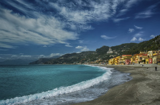 Beach people hill blue sky - a hill in the background free wallpaper