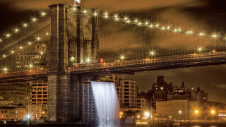 Bridge waterfall night lights buildings - long exposure free wallpaper for desktop