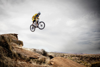Man bike jumping hill cloudy - adobe lightroom free wallpaper