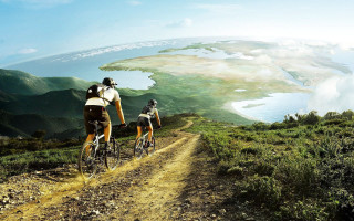 Couple biking dirt road lake 2 - a lake and mountains free wallpaper for desktop