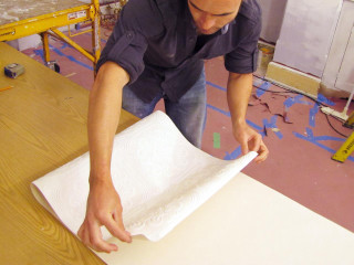 Man making paper table whiteboard - a piece of paper free wallpaper