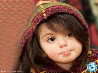 Little girl colorful jacket smiling - a little girl free wallpaper for desktop