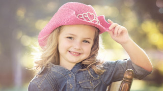 Little girl pink hat smiling 2 - a pink hat free wallpaper