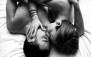 Man woman laying bed together - the others head free wallpaper