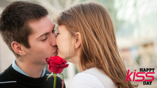 Man kissing woman red rose - free valentines wallpaper