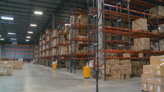 Warehouse boxes forklift center aisle - a warehouse free wallpaper