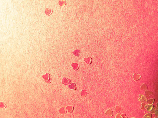 Cell phone hearts pink background - a close up of a cell phone free wallpaper