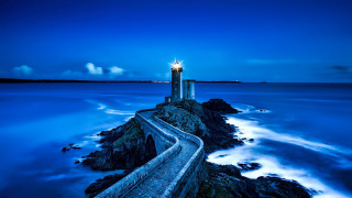 Lighthouse rocky shore blue sky - the right side free wallpaper