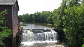 Waterfall river trees red building - a red roof free wallpaper