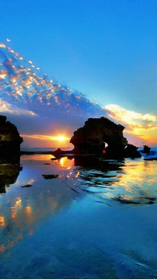 Sunset water rocks sky clouds 2 - a sunset over a body of water free wallpaper for mobile