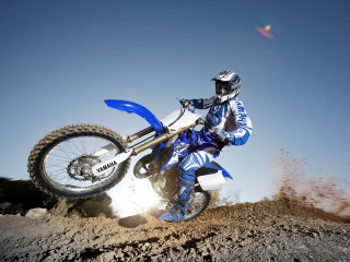 Dirtbike rider dirtfield sky motionblur - a dirt bike free wallpaper