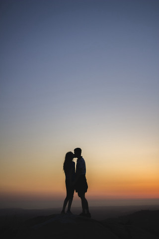 Couple hill sunset sky kissing - free valentines wallpaper for mobile