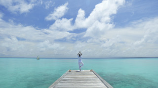 Woman dock ocean arms up - tranquil free wallpaper