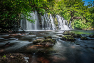 Waterfall rocks trees blue sky - a bunch of rocks free wallpaper