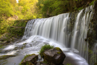 Waterfall large rock forest background - a waterfall free wallpaper