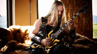 Man longhair blackshirt playing guitar - jimmy nelsson free wallpaper